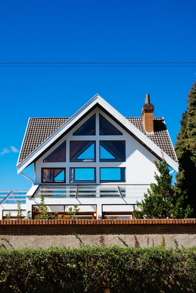 White Concrete House Under Clear Blue Sky